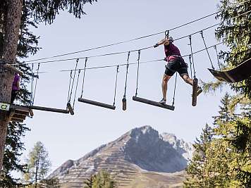 High ropes course with mountain backdrop